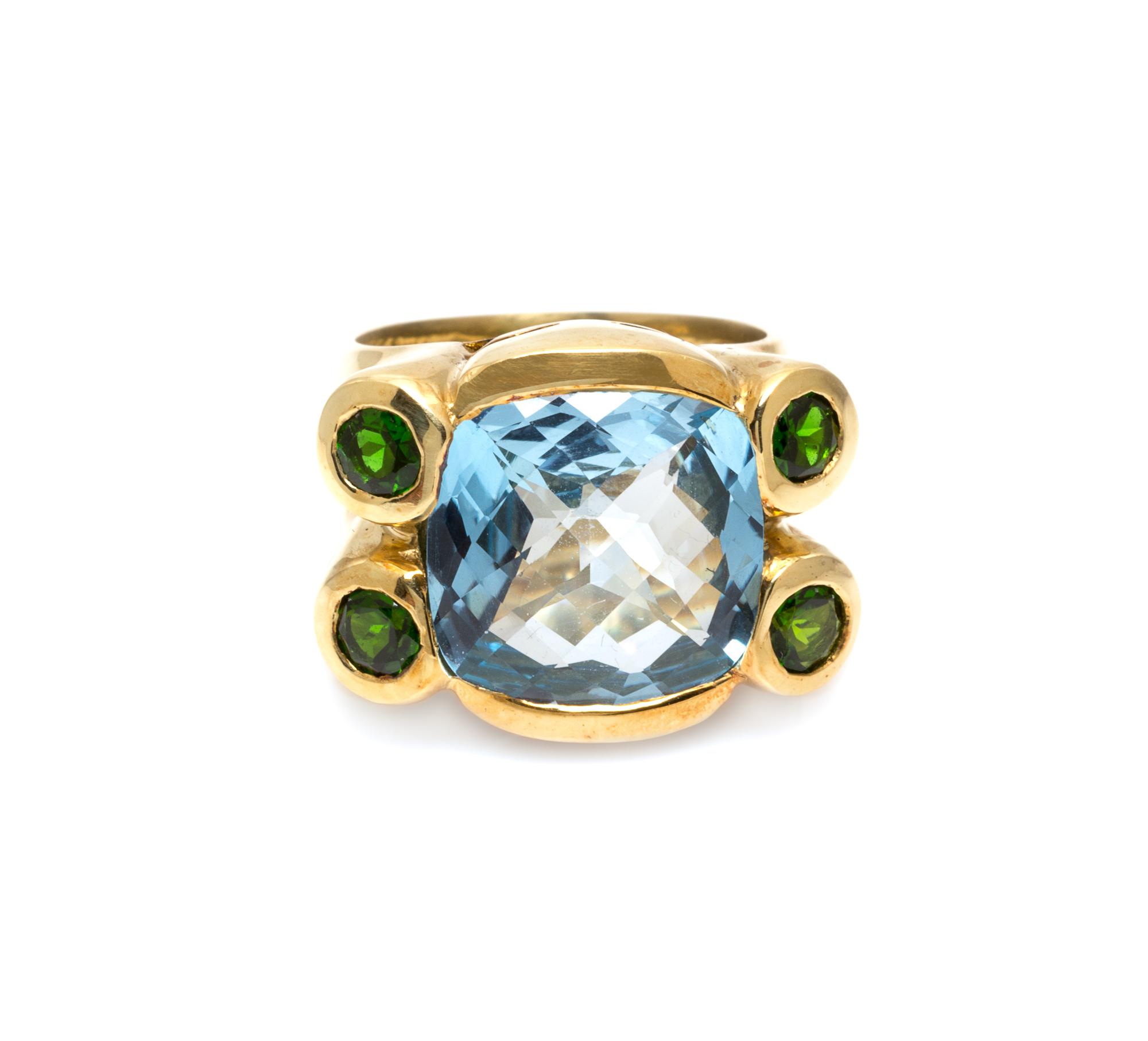 An 18 Karat Yellow Gold, Blue Topaz and Green Tourmaline Ring, 13.00 dwts.