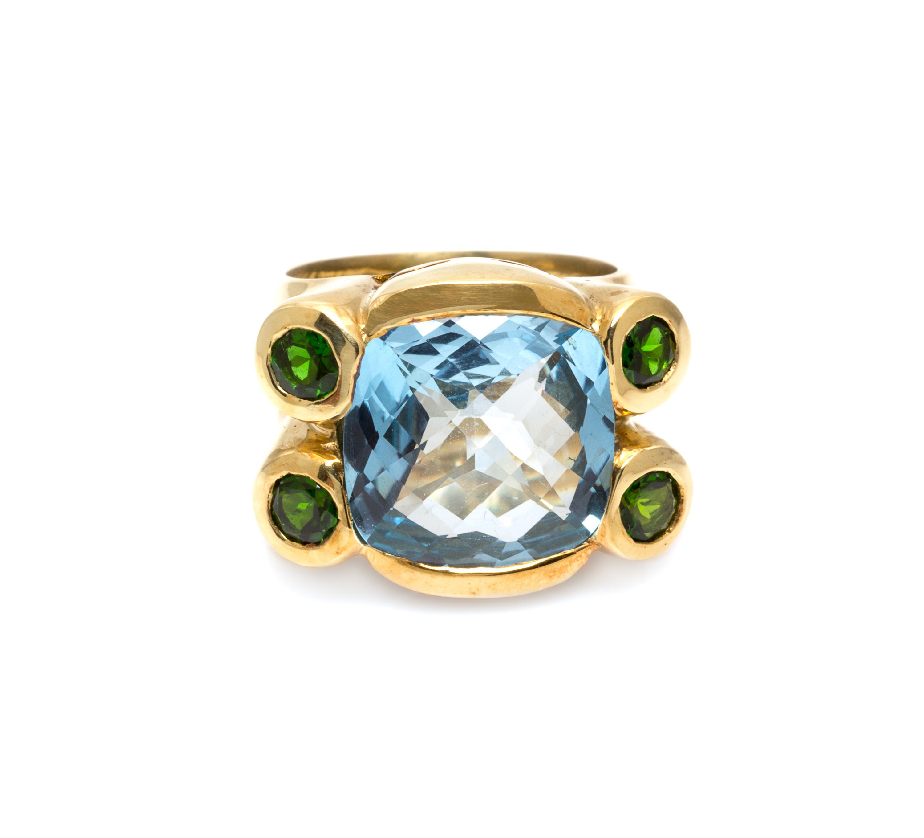 An 18 Karat Yellow Gold, Blue Topaz and Green Tourmaline Ring, 13.00 dwts.