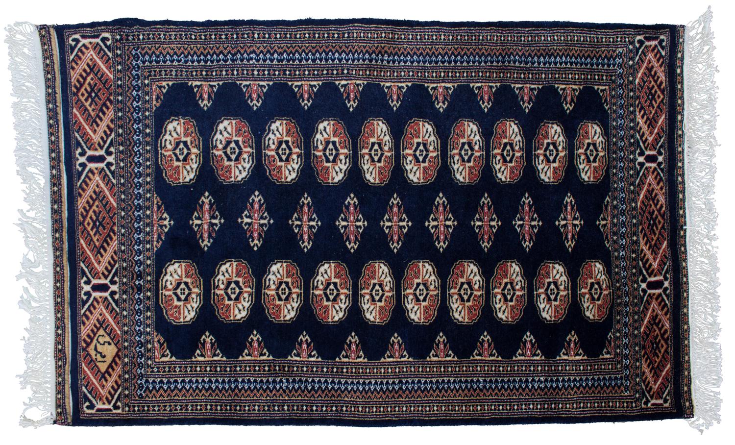 A Bokhara Style Rug 4 feet 1 inch x 2 feet 8 inches.