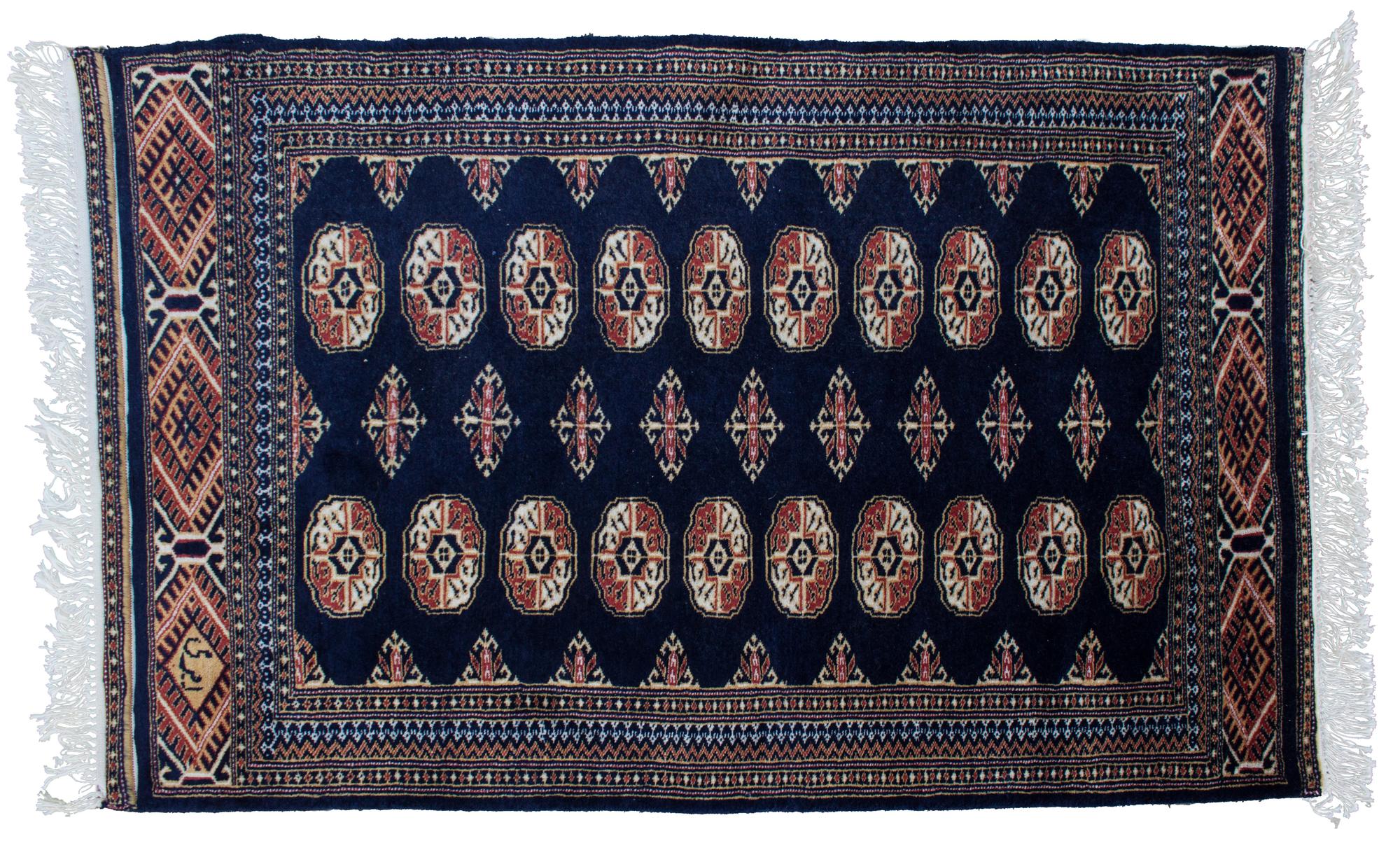 A Bokhara Style Rug 4 feet 1 inch x 2 feet 8 inches.