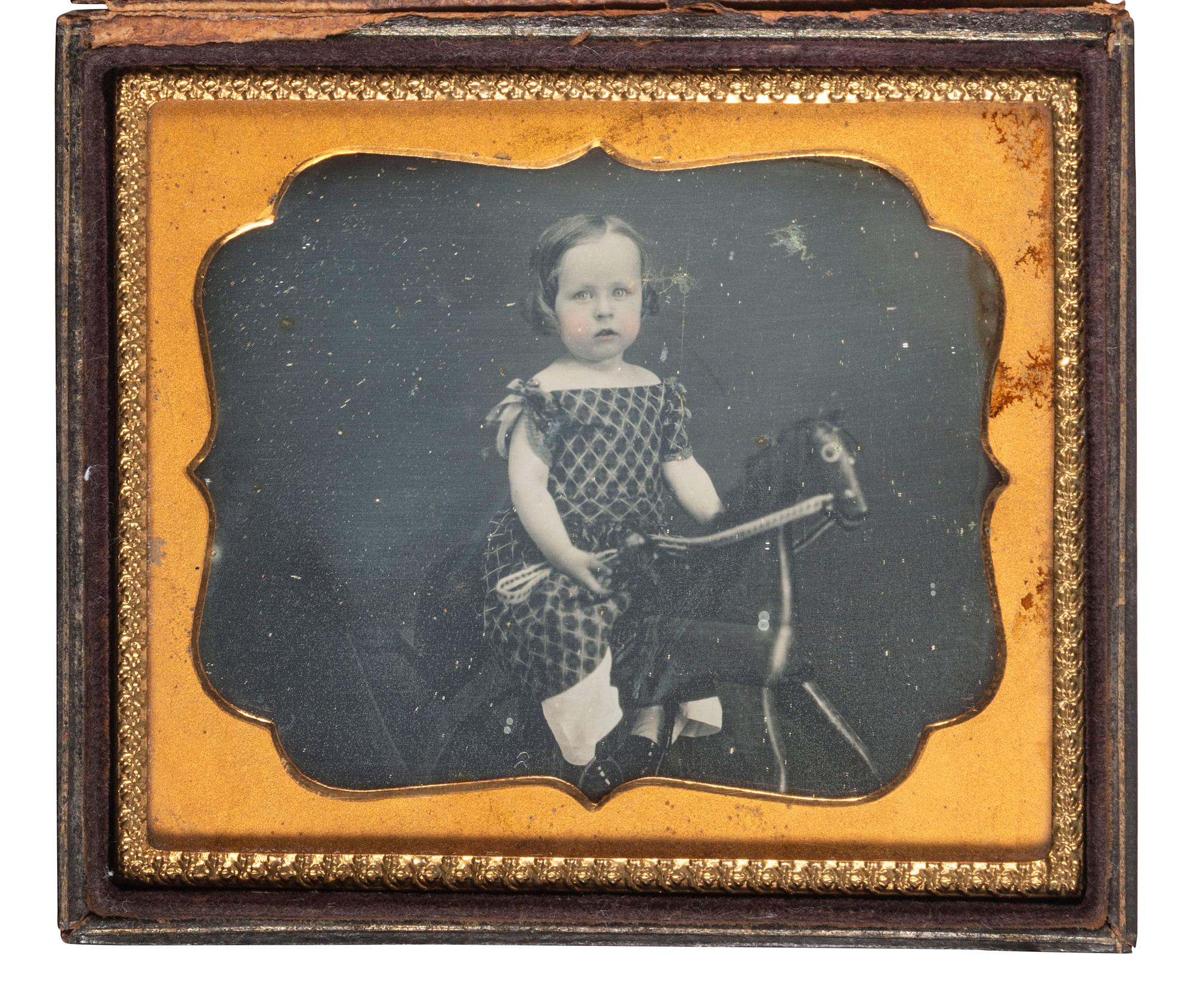 [EARLY PHOTOGRAPHY]. Sixth plate daguerreotype featuring a young girl on a hobby horse.