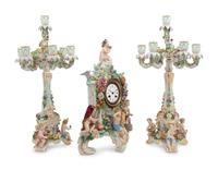 A Meissen Porcelain Clock Garniture and Clock Stand