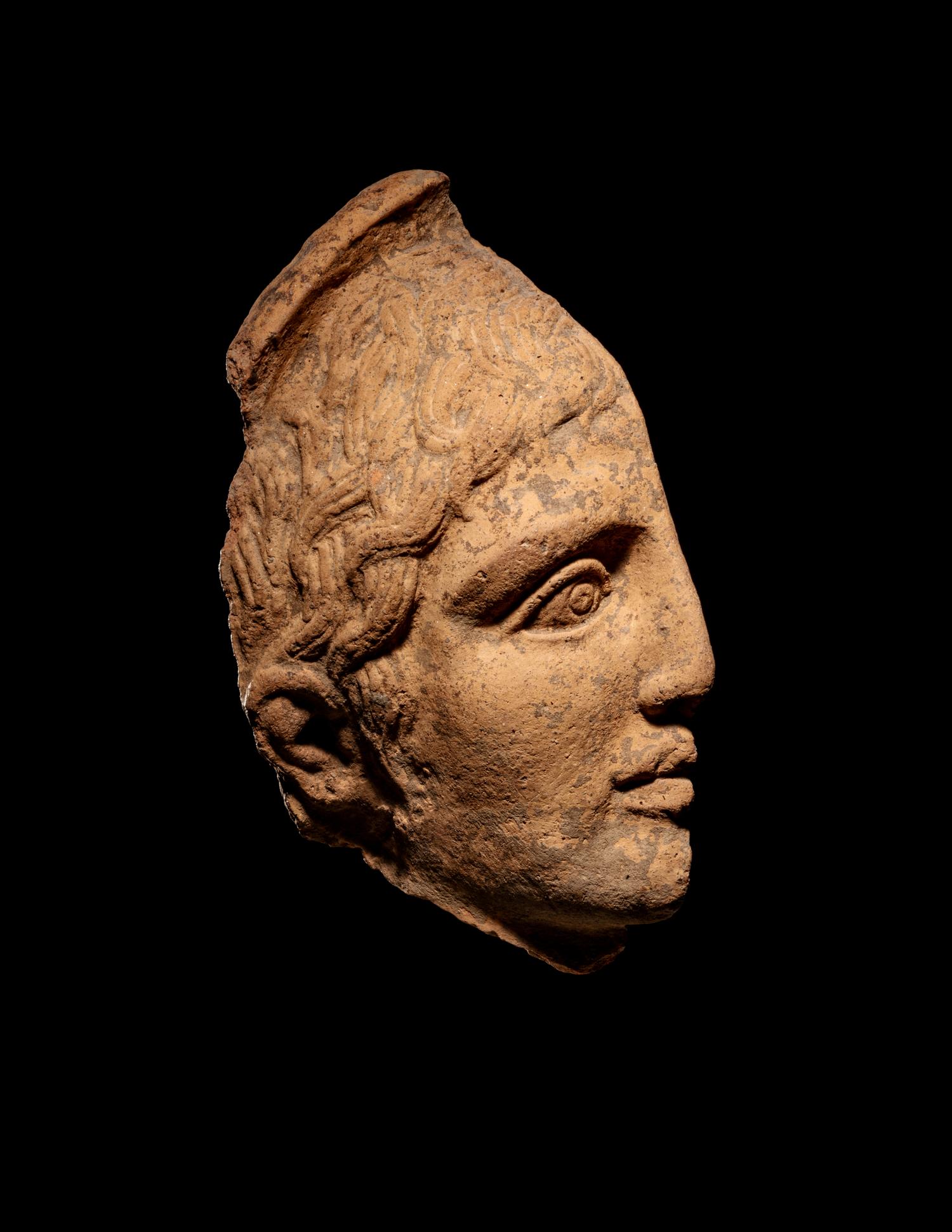 An Etruscan Terra Cotta Votive Half Head