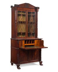 A Regency Carved and Figured Mahogany Secretary Bookcase