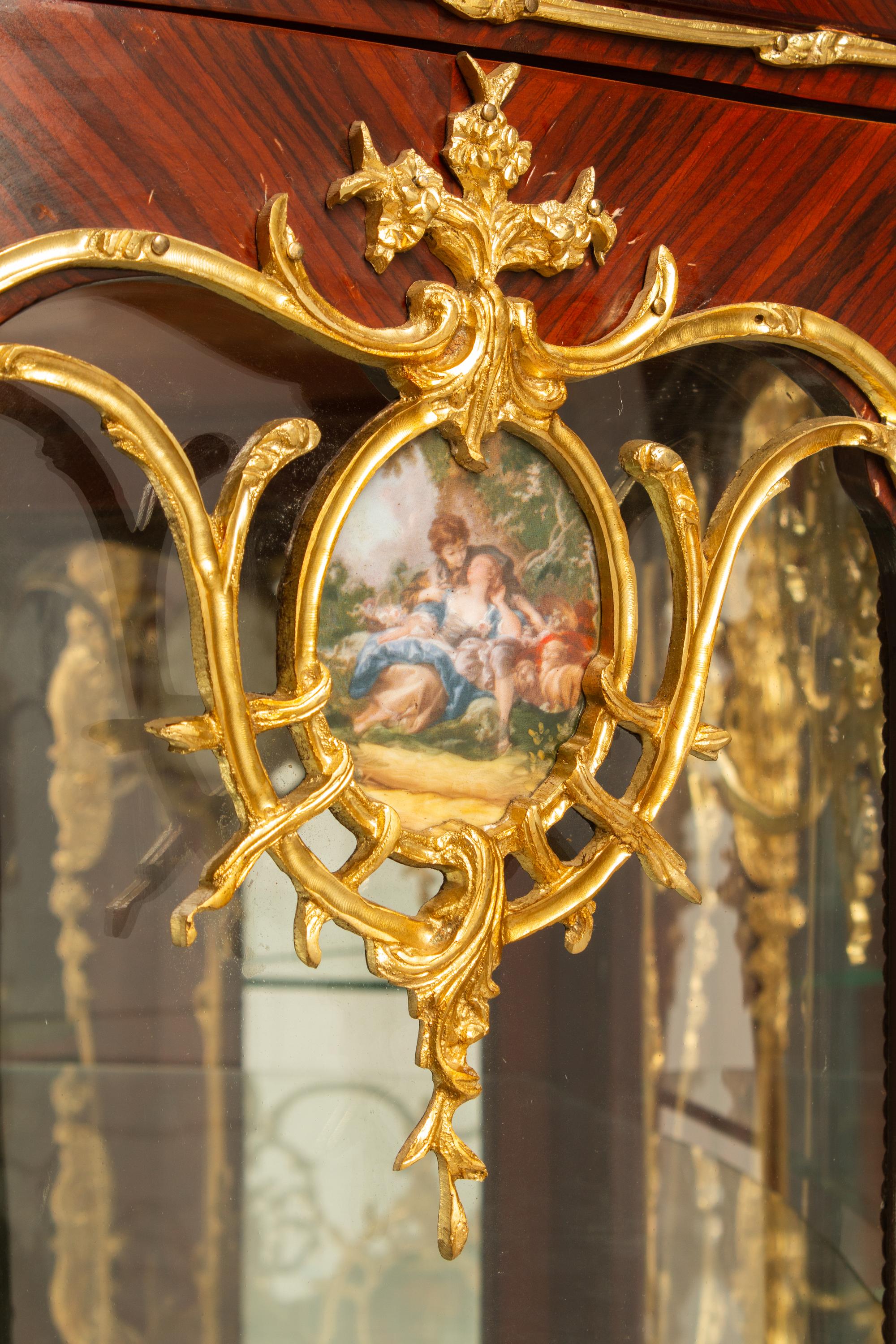 A Pair of Louis XV Style Gilt Bronze Mounted Vitrine Cabinets