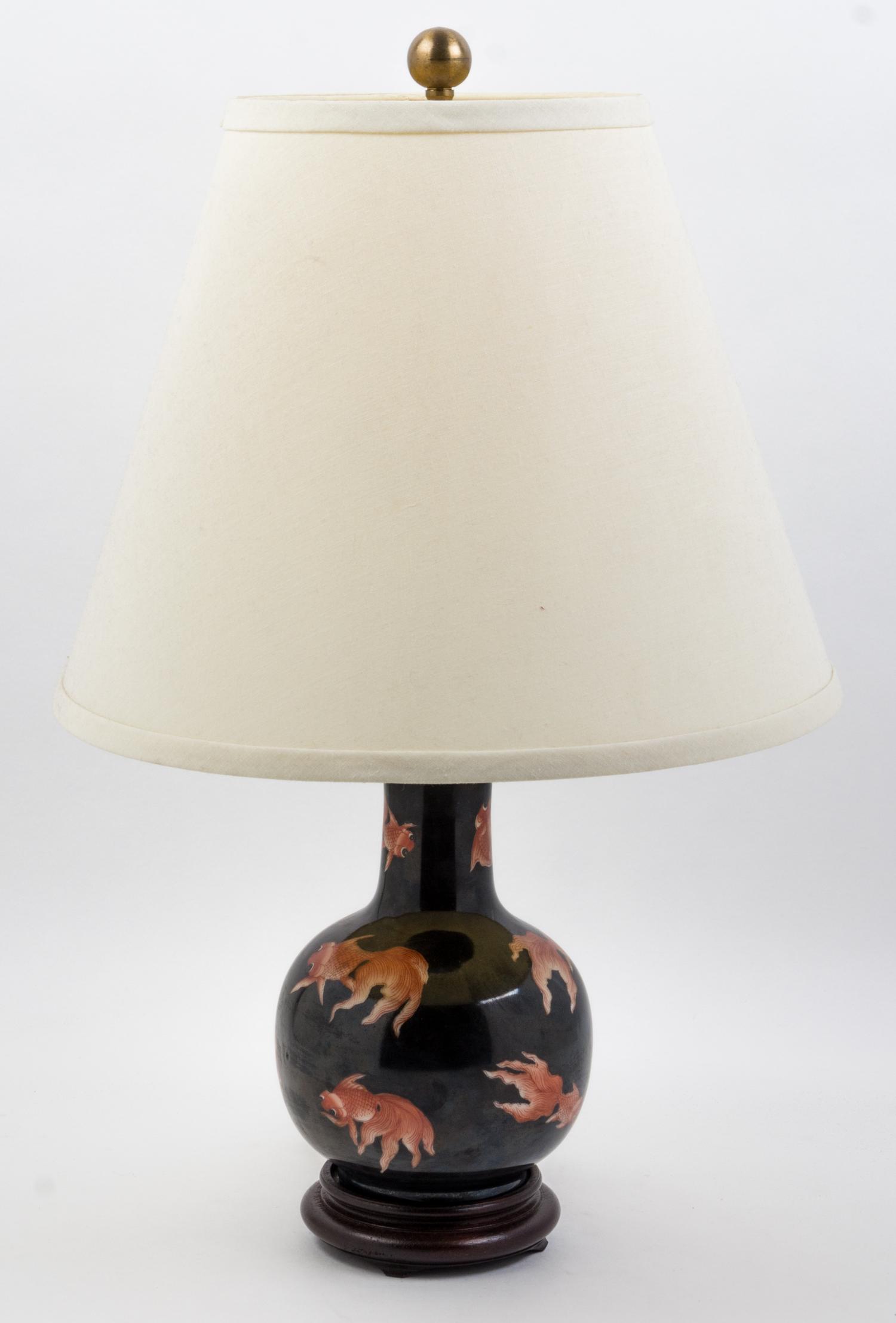 A Chinese Famille Noire Porcelain Vase Height 8 1/2 inches.