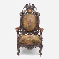 A Rococo revival carved oak fire company armchair circa 1860