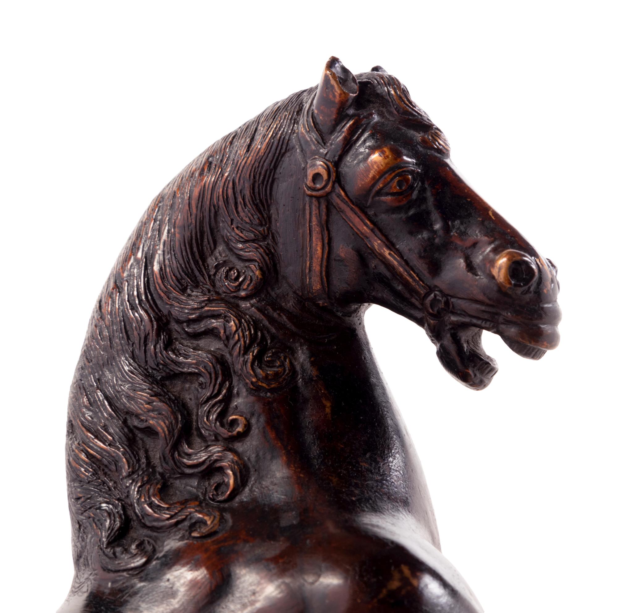 An Italian Bronze Model of a Horse on a White Marble and Porphyry Base