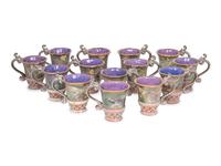 A Set of Fourteen MacKenzie-Childs Evervolving Ceramic Mugs