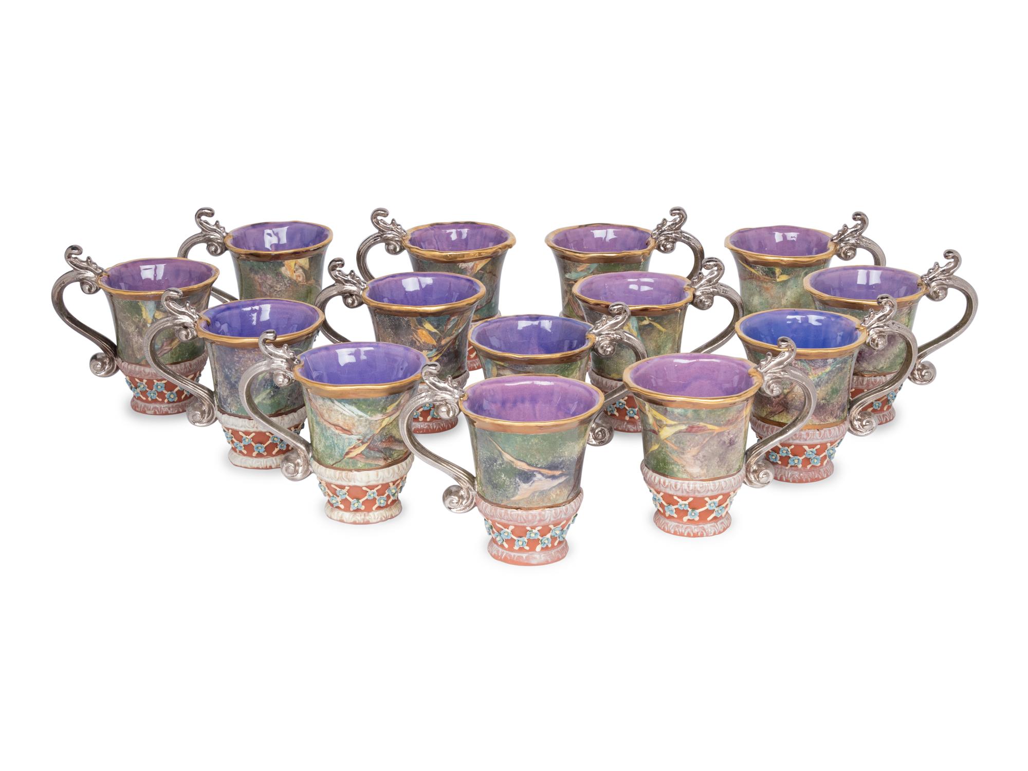 A Set of Fourteen MacKenzie-Childs Evervolving Ceramic Mugs