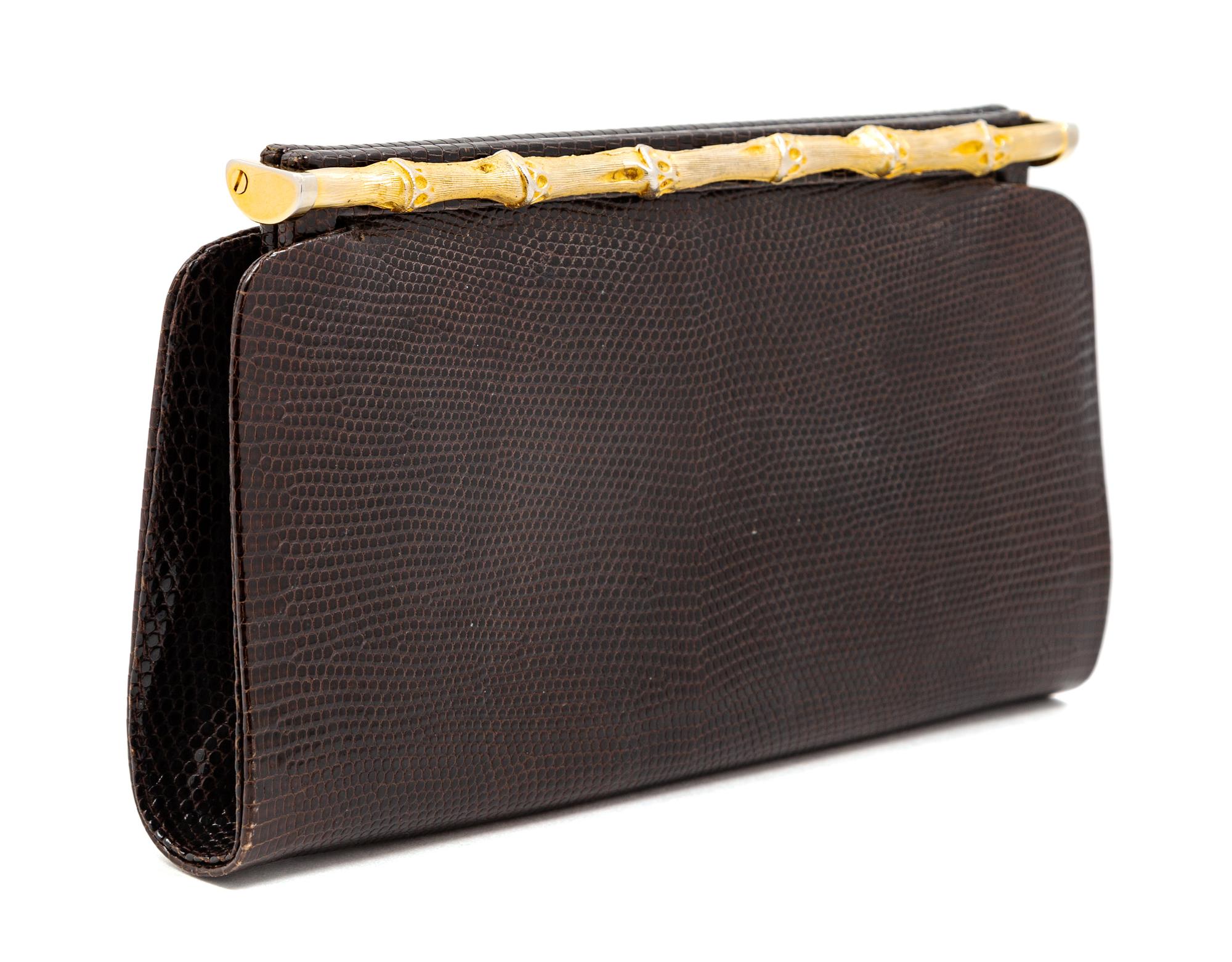 A Gucci Brown Snakeskin Clutch, 4.75" H x 8.25" W x 1.25" D.