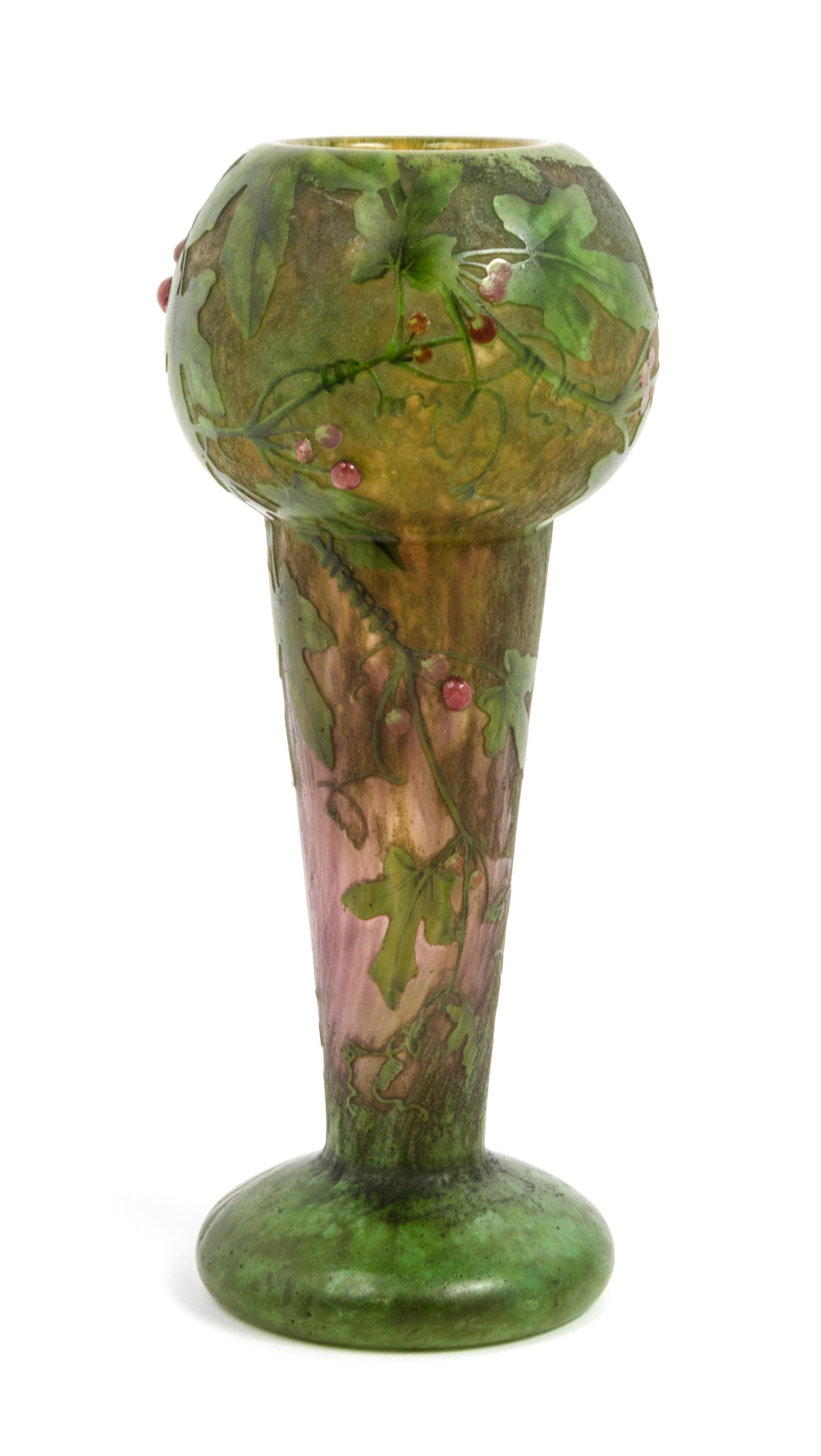 Daum, EARLY 20TH CENTURY, enameled and applied cameo glass vase, of baluster form decorated with berry laden leafy branches,