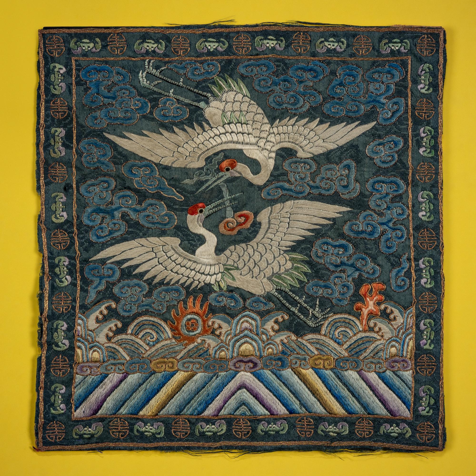 A Pair of Korean Embroidered Silk 'Double Crane' Rank Badges and a Vietnamese Salmon Pink Ground Embroidered Silk 'Crane' Rank Badge, Late 19th Century — 十九世紀晚期 朝鮮王朝文官鶴紋補子一對及越南鶴紋補子