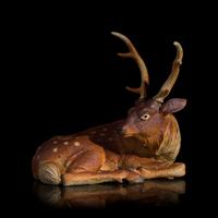 A Japanese Studio Ceramic Figure of a Recumbent Deer, Meiji/Taisho Period