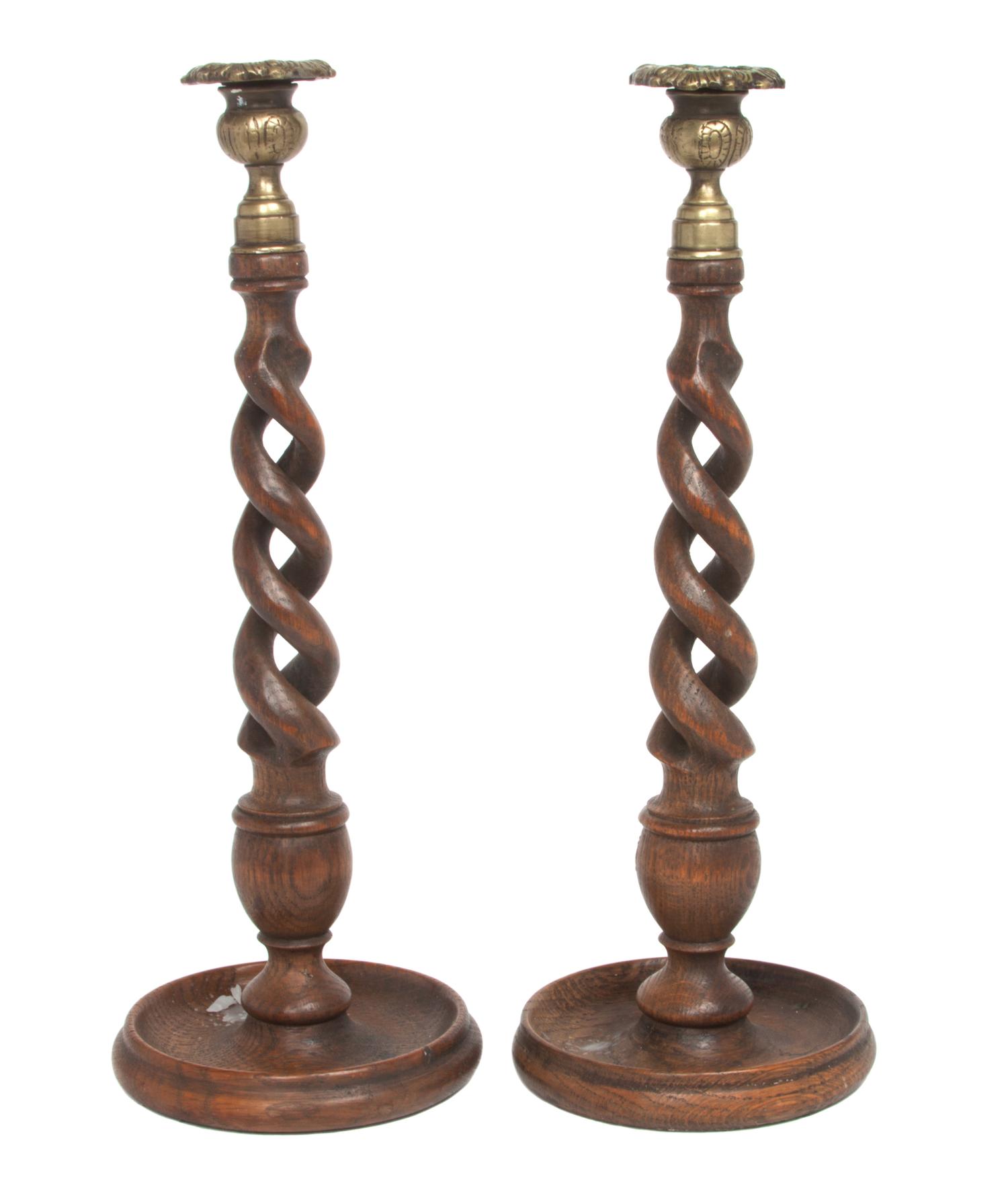 A Pair of English Oak and Brass Candlesticks Height 14 inches. — EARLY 20TH CENTURY