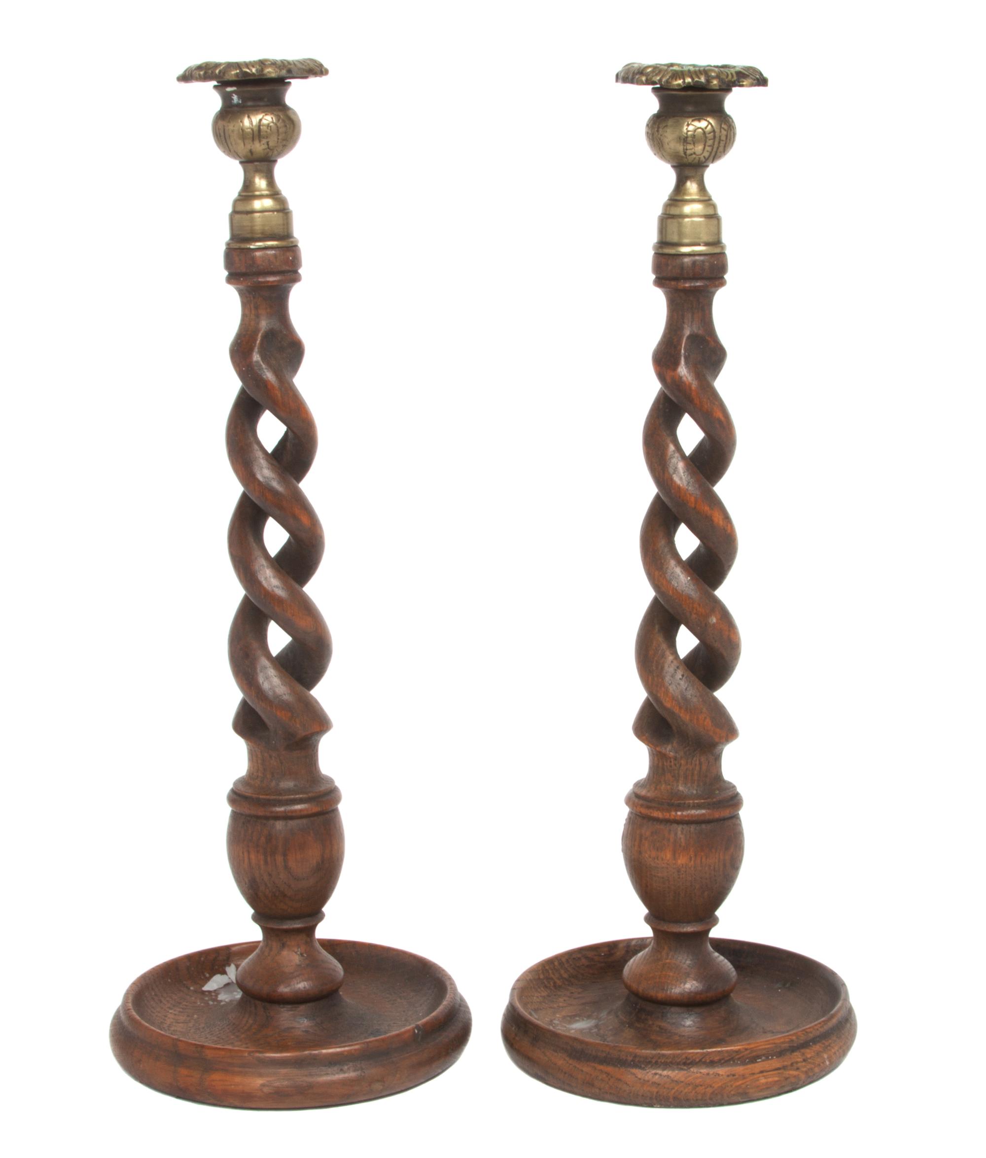A Pair of English Oak and Brass Candlesticks Height 14 inches. — EARLY 20TH CENTURY