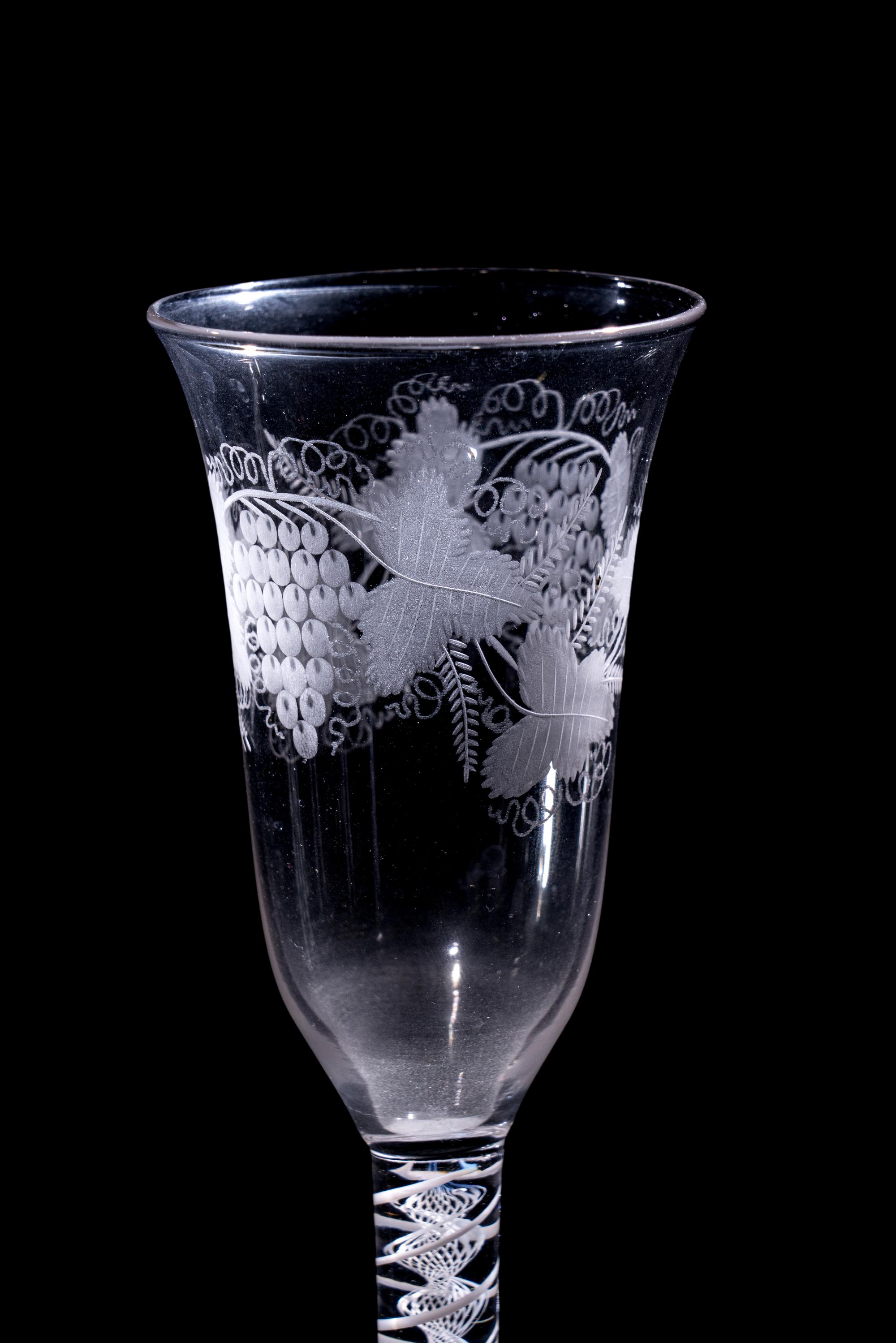 A Set of Seven Engraved Glass Cordials with Twist Stems