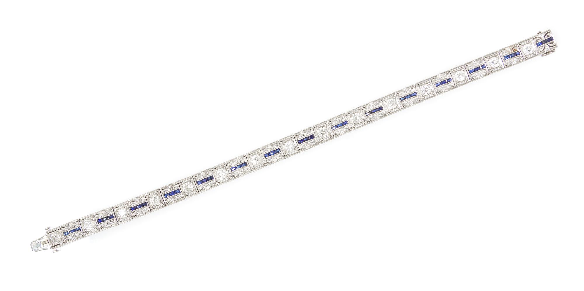 An Art Deco Platinum, Diamond and Synthetic Sapphire Bracelet, 14.50 dwts.
