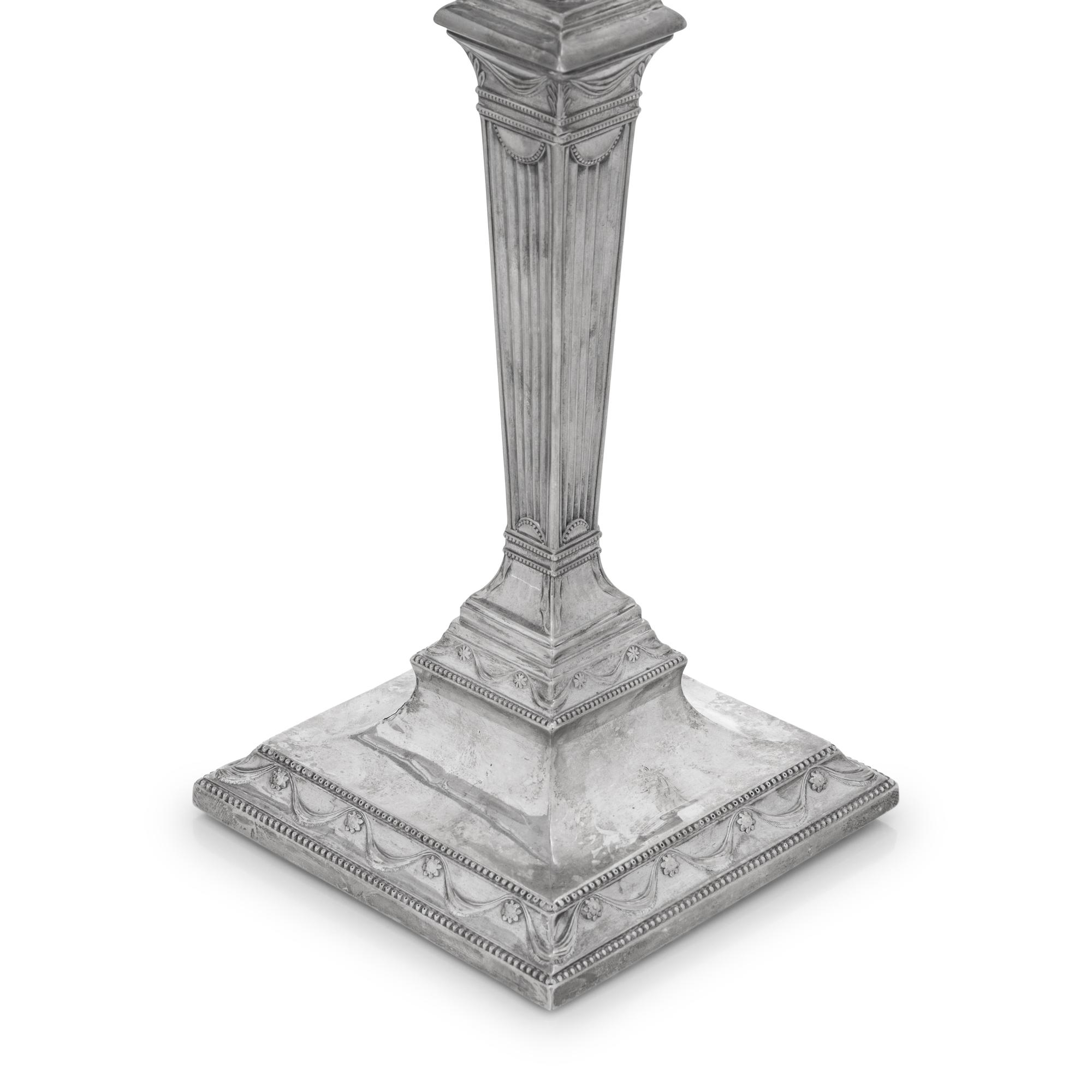 A Set of Four Neoclassical Silver Candlesticks