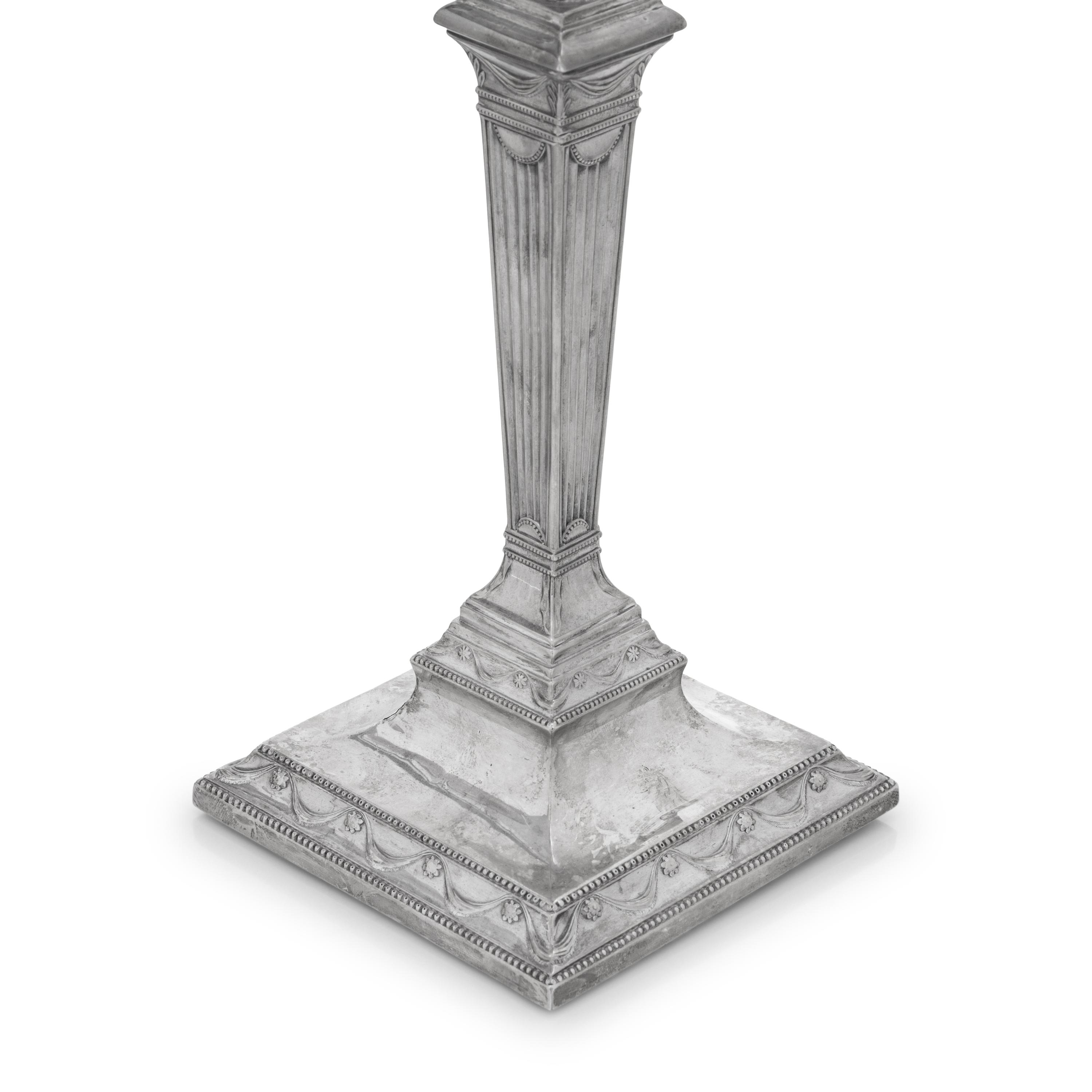 A Set of Four Neoclassical Silver Candlesticks