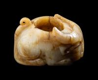 A Chinese Archaistic Yellow Jade Buffalo-Form Archer's Ring