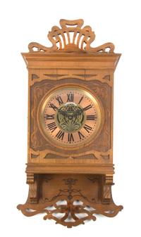 A German Art Nouveau Mahogany Wall Clock, Height 32 inches.