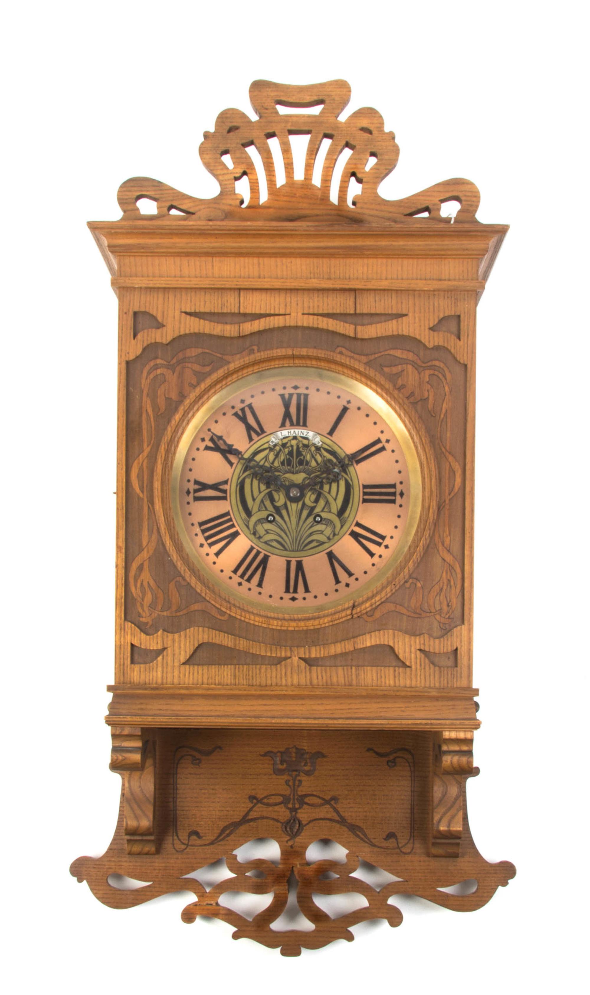A German Art Nouveau Mahogany Wall Clock, Height 32 inches.