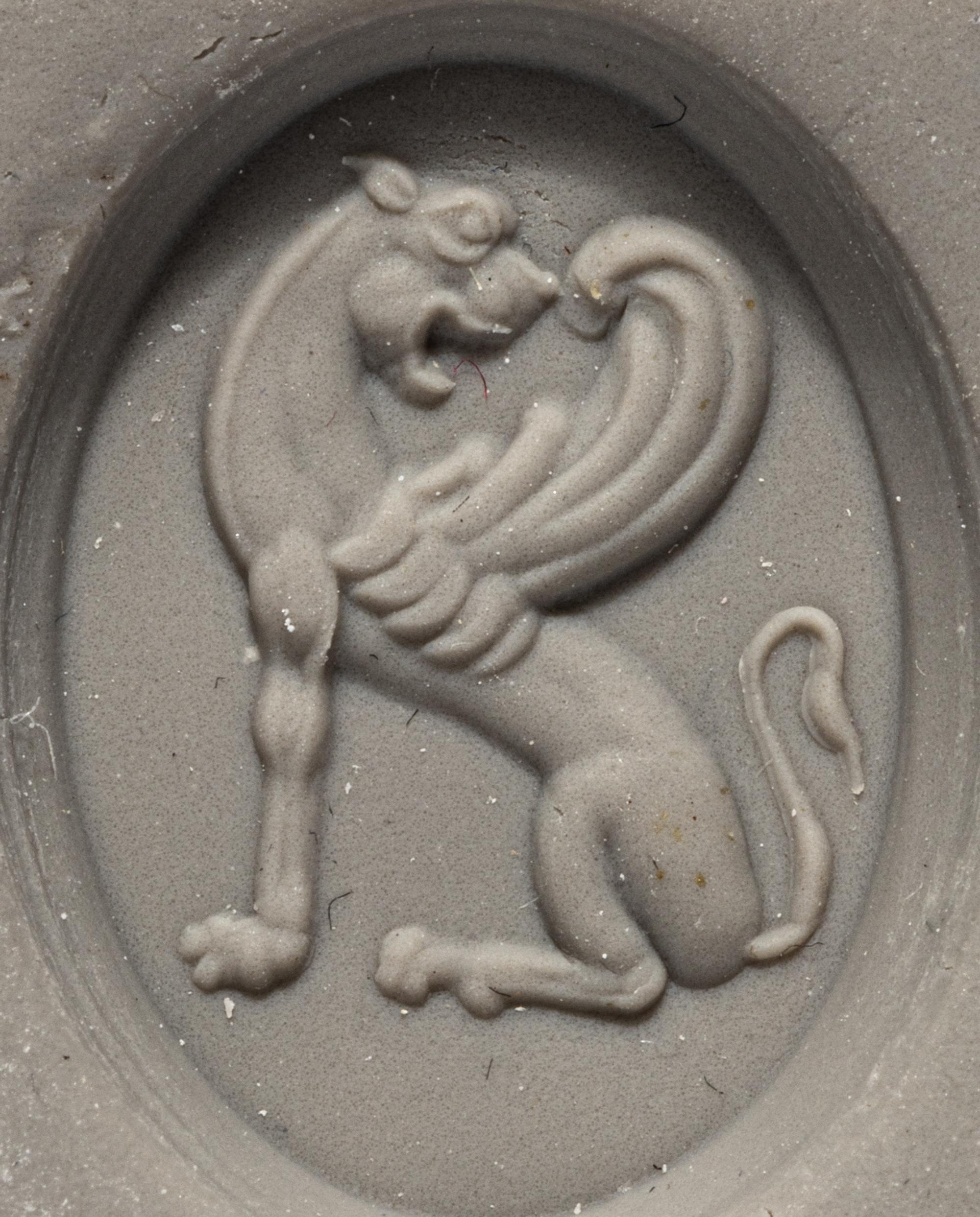 A Greco-Persian Style Bloodstone Intaglio with a Winged Griffin
