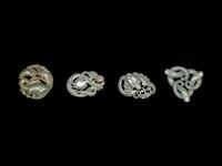 Four Chinese Celadon Jade Carved 'Animal' Pendants