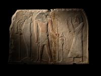 An Egyptian Limestone Round-Topped Stele