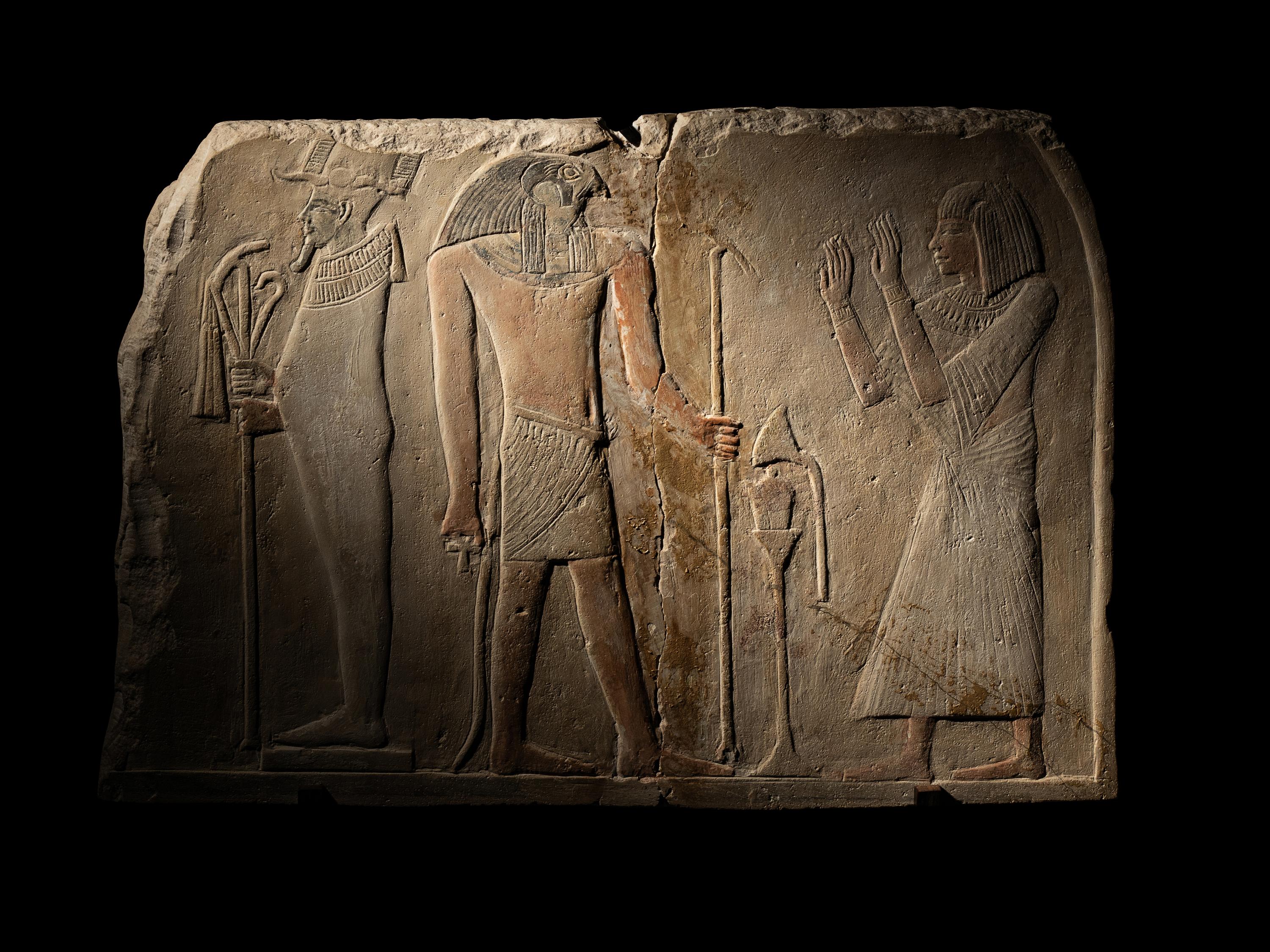 An Egyptian Limestone Round-Topped Stele