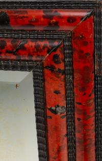 A Flemish Baroque Style Faux Tortoise and Ebonized Wood Mirror