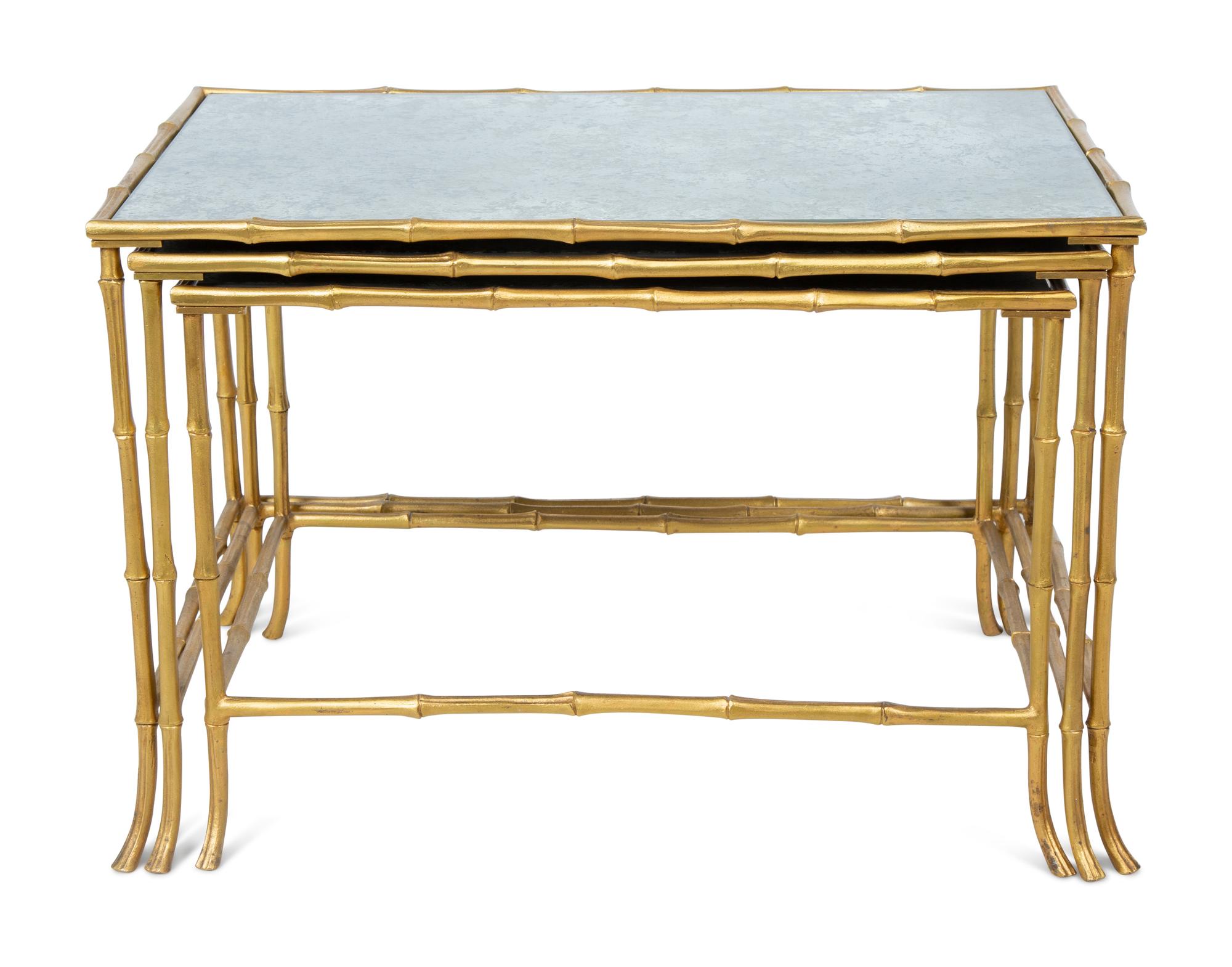 A Set of Three Gilt Metal Mirrored Nesting Tables in the Style of Maison Bagues