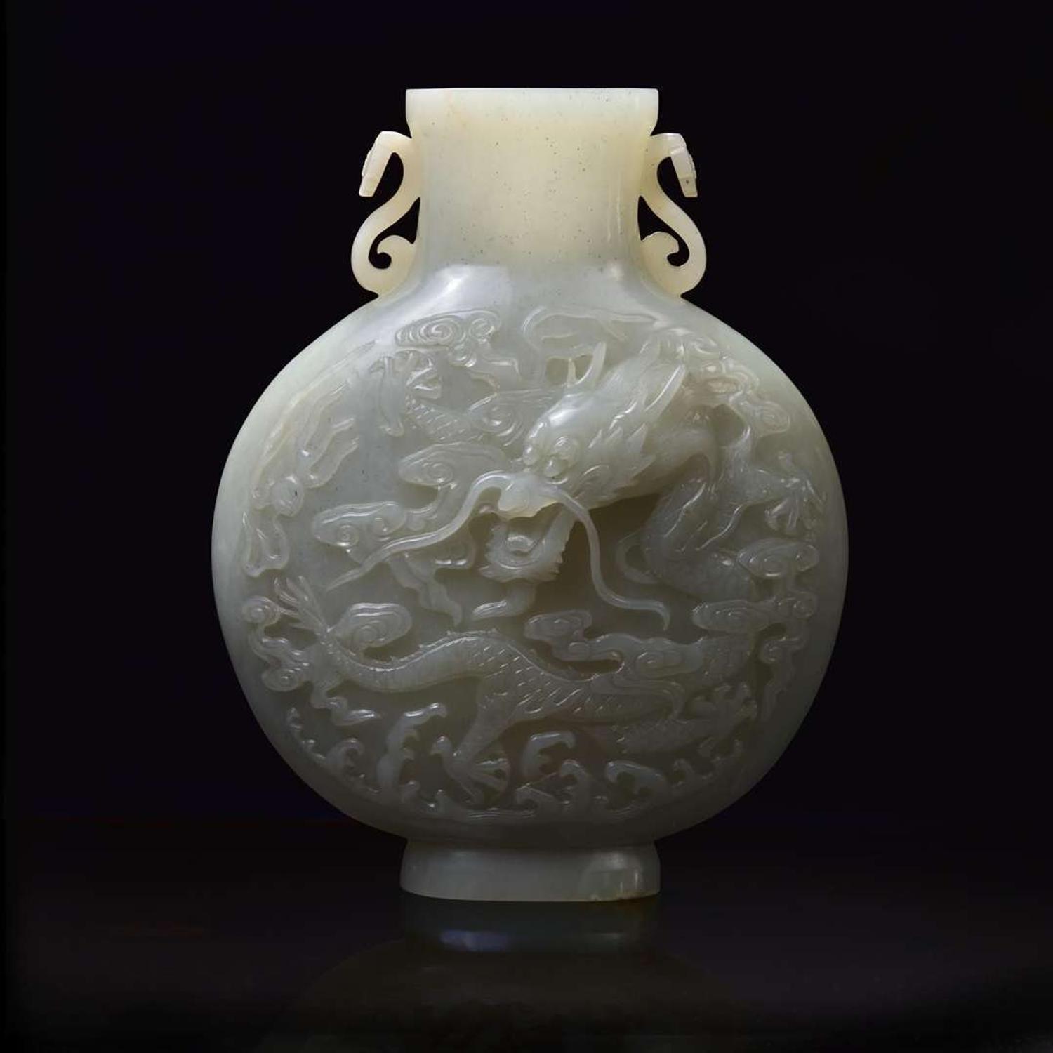 A Chinese carved celadon-grey jade "Dragon and Phoenix" moon-flask vase 青白玉龙凤纹抱月瓶