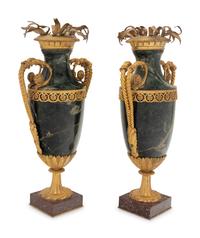 A Pair of Gilt Bronze Mounted Marble Urns on Porphyry Bases