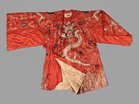 A Chinese Orange Ground Embroidered Silk Theatrical Dragon Robe