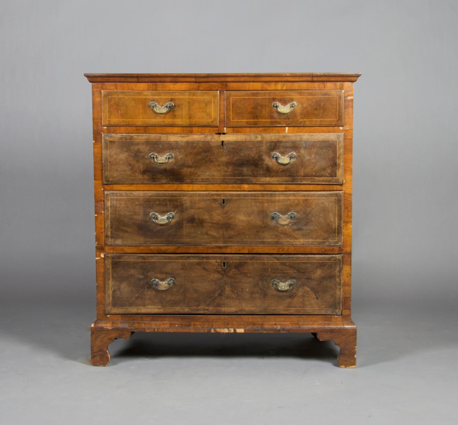 A George II Walnut Chest of Drawers, Height 41 1/4 x width 38 1/2 x depth 19 3/4 inches.