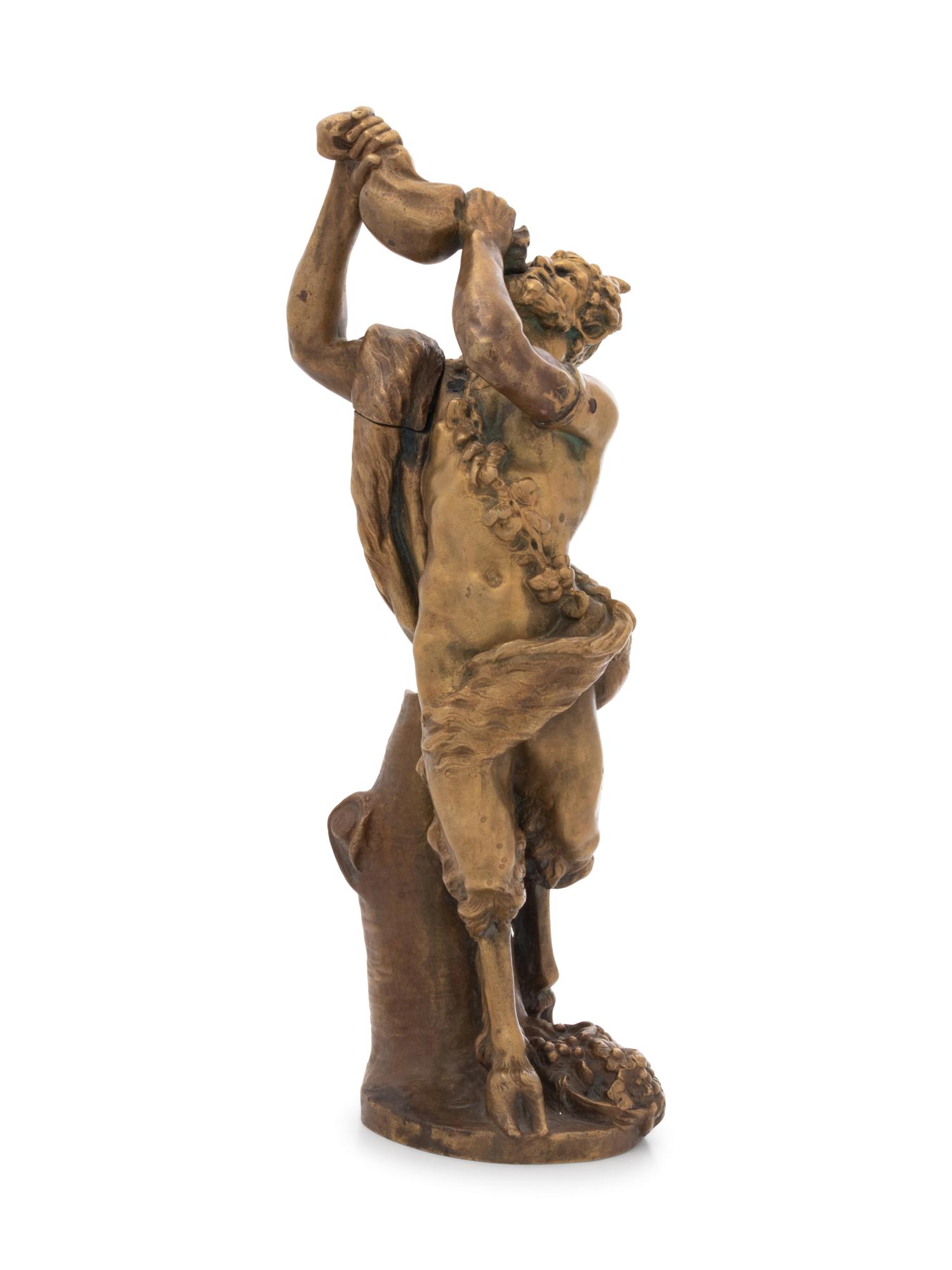 A Continental Gilt Bronze Figure of a Satyr Drinking from a Wine Skin