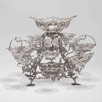 A Victorian sterling silver fourteen-basket epergne Francis Boone Thomas, London, 1884