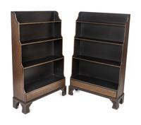 A Pair of Regency Style Ebonized and Gilt Waterfall Book Shelves — 19TH/20TH CENTURY