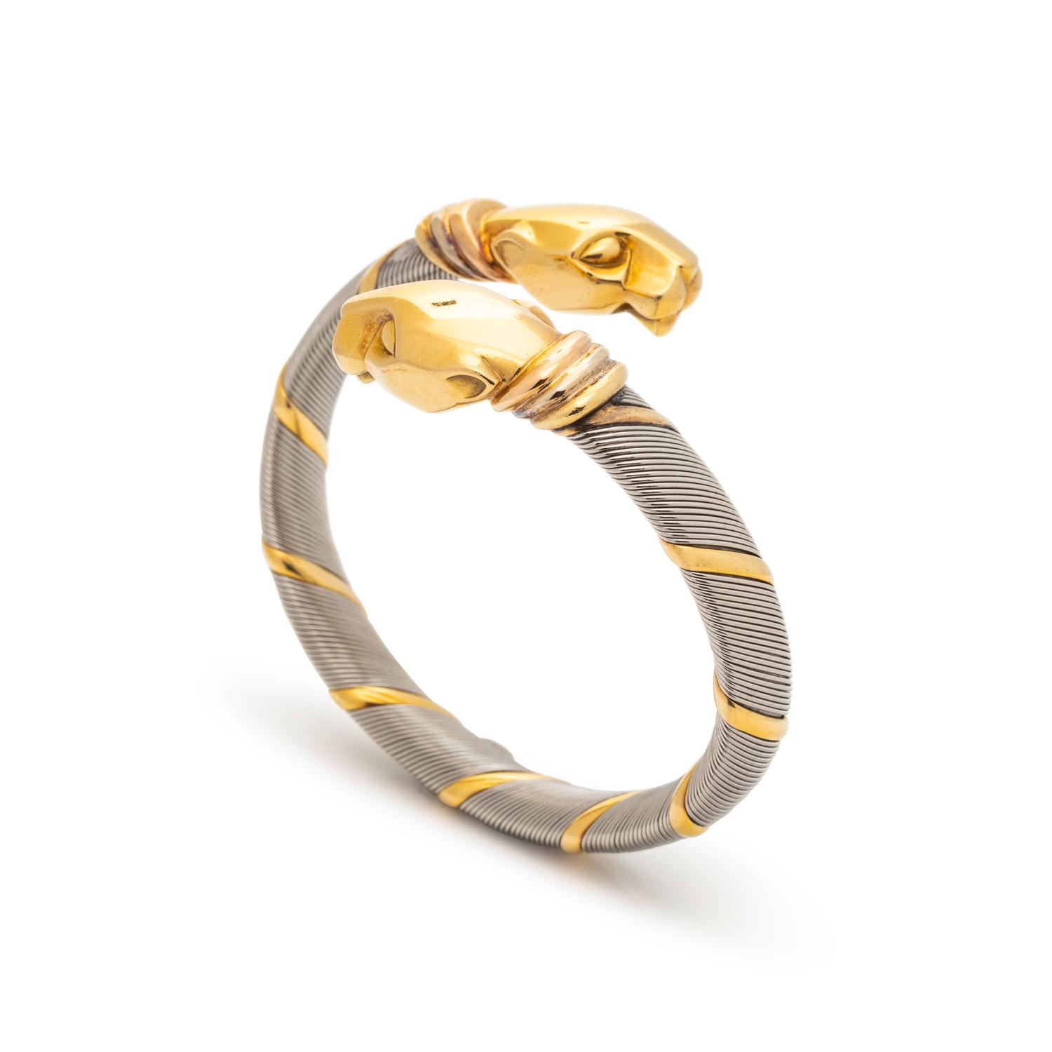 CARTIER, STEEL AND YELLOW GOLD PANTHER BYPASS BANGLE BRACELET