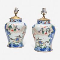 A pair of large Chinese wucai-decorated porcelain jars, mounted as lamps