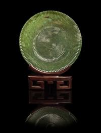 A Chinese Spinach Jade Mughal-Style Chrysanthemum Dish LATE QING DYNASTY, 19TH CENTURY Diameter 7 1/2 inches. — LATE QING DYNASTY, 19TH CENTURY