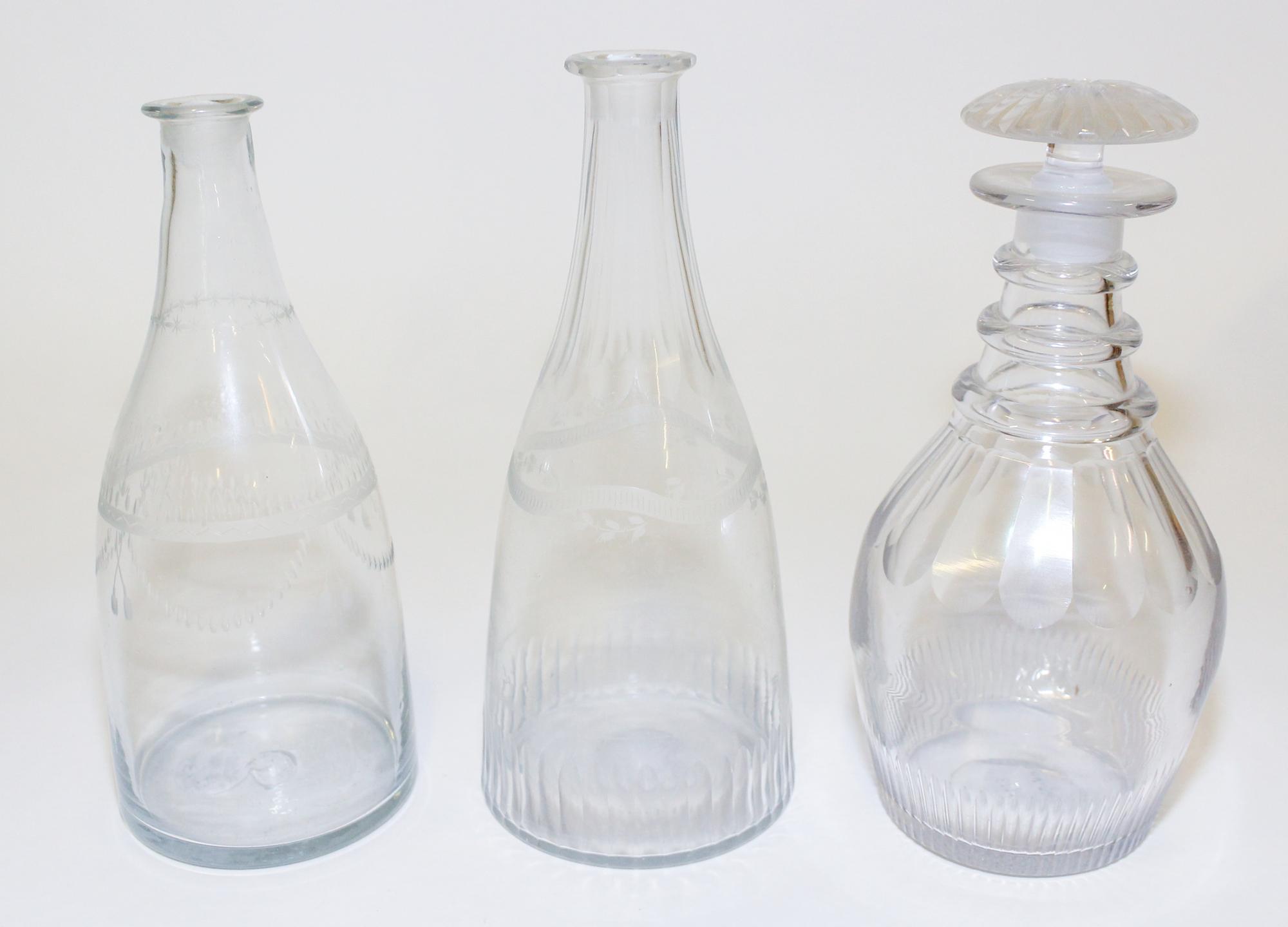 A Group of Three Cut and Etched Glass Decanters Height of tallest 9 1/4 inches. — EARLY 19TH CENTURY