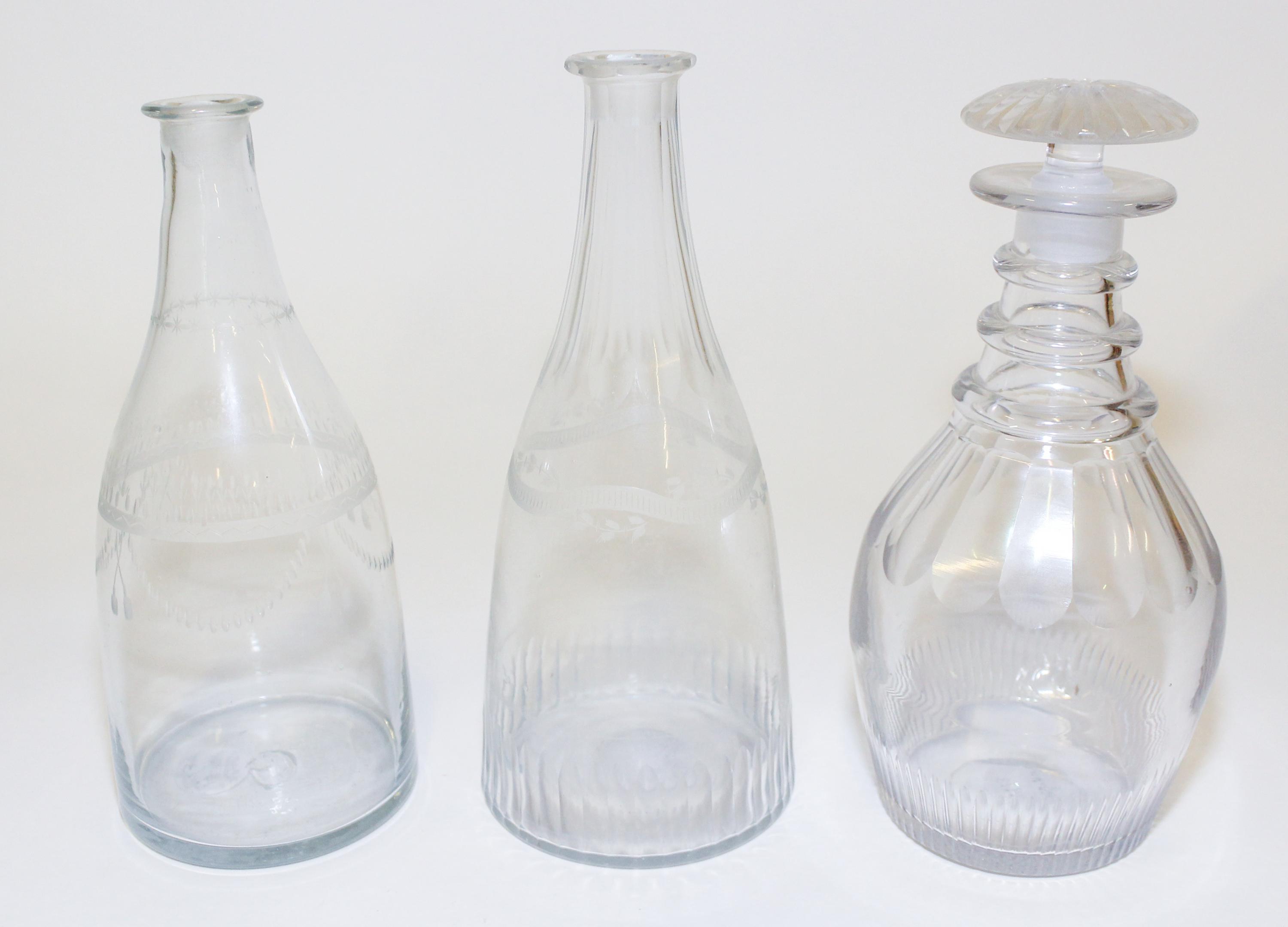 A Group of Three Cut and Etched Glass Decanters Height of tallest 9 1/4 inches. — EARLY 19TH CENTURY