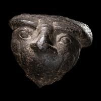 An Egyptian Basalt Falcon Face Fragment