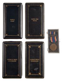 [WORLD WAR II AND PRE-WAR]. A group of 5 medals, including a Purple Heart, two Legion of Merit and one Silver Star.