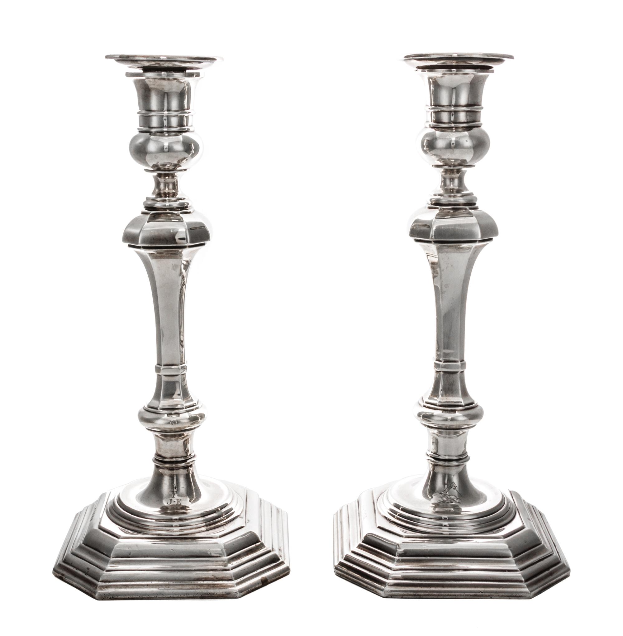 A Pair of Queen Anne Style Silver Candlesticks, Crichton Bros., London, 1919, each of square baluster form with weighted base.