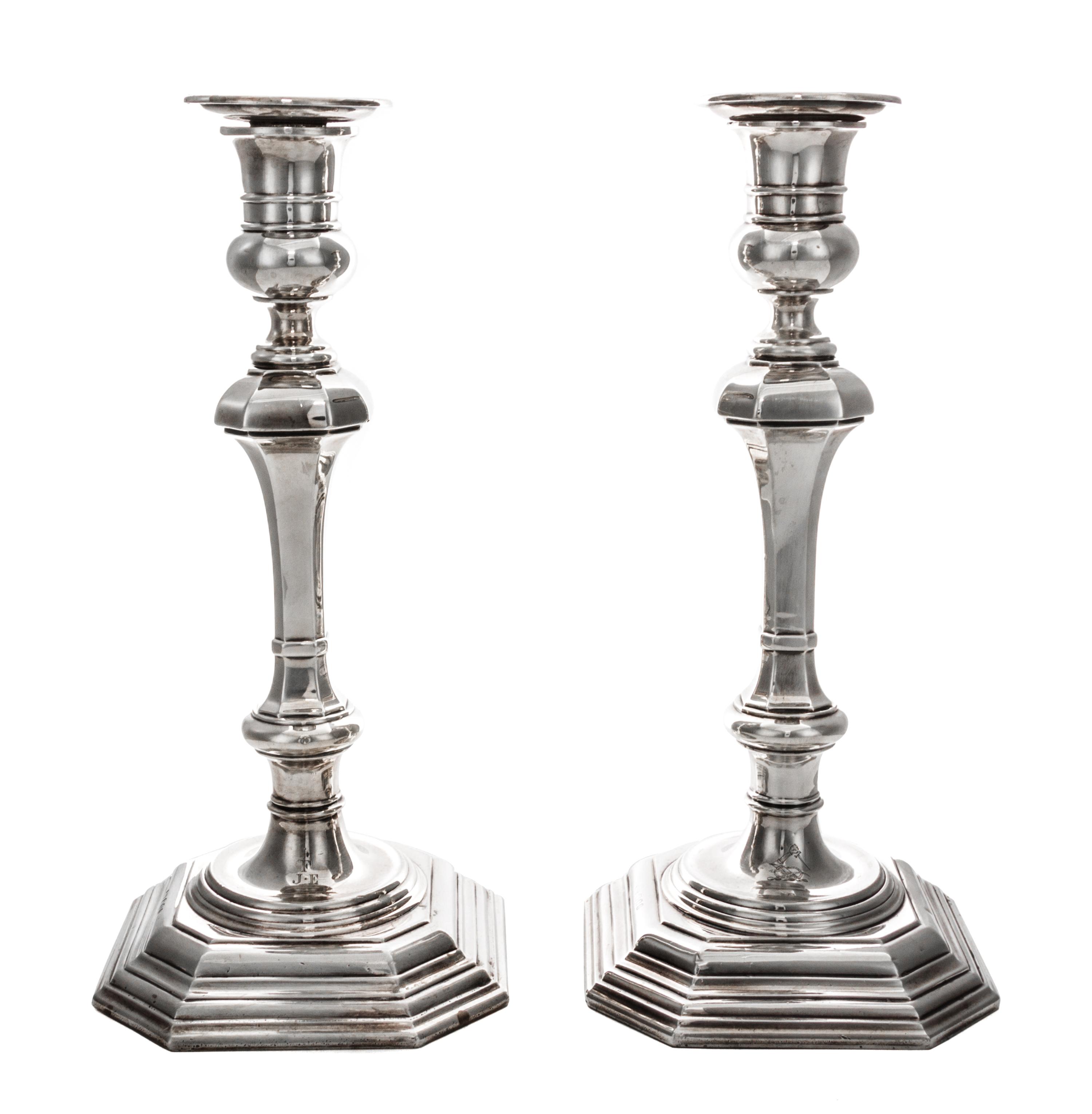 A Pair of Queen Anne Style Silver Candlesticks, Crichton Bros., London, 1919, each of square baluster form with weighted base.