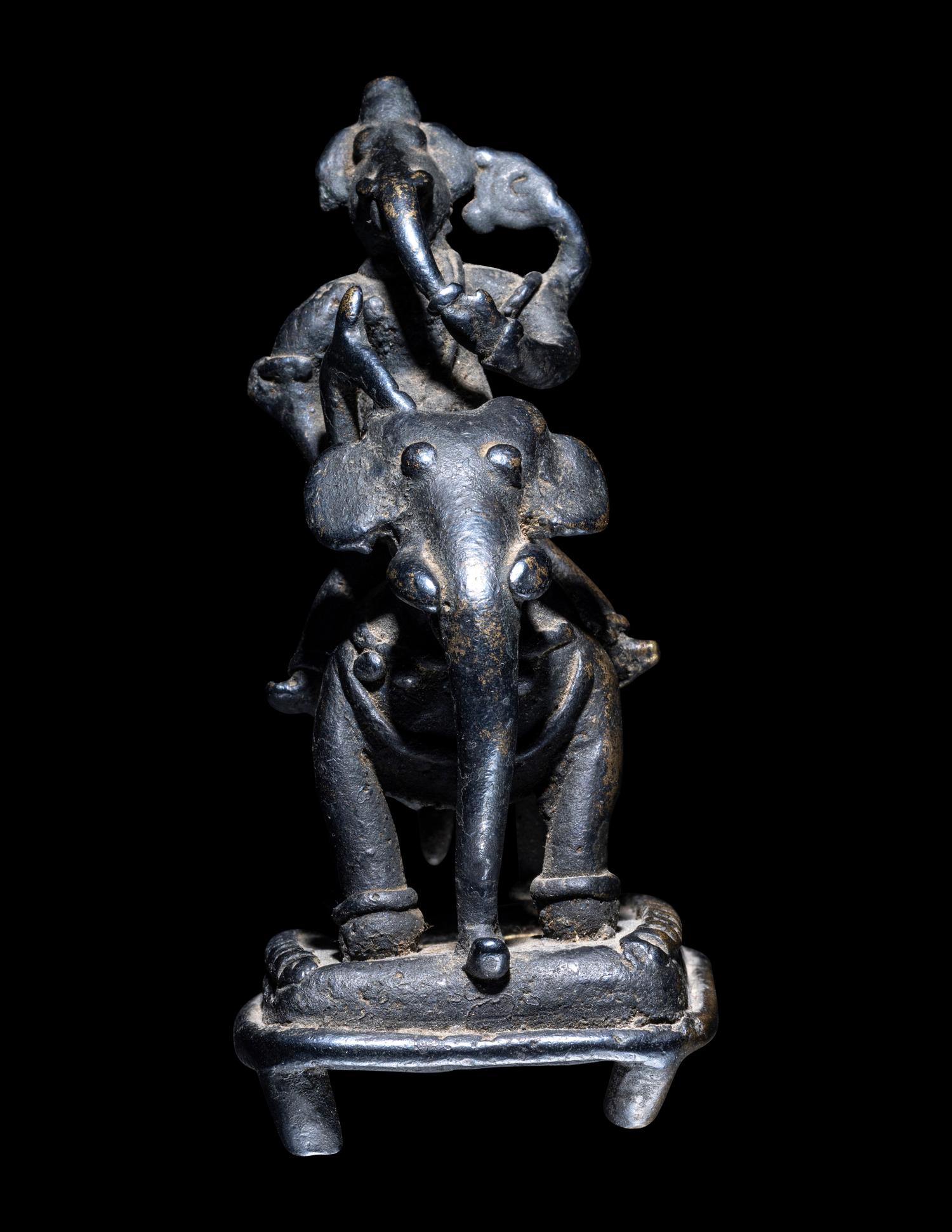 An Indian Bronze Figural Group of Ganesha Riding an Elephant